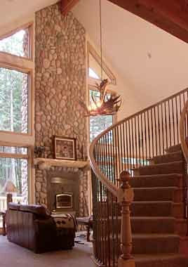 Picture of circular staircase in the great room of the model P-801 house plan.